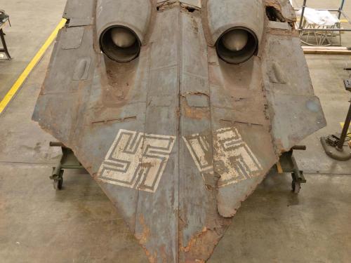 Aft view of the Horten Ho 229 V3, a gray World War II-era aircraft with white swastikas.