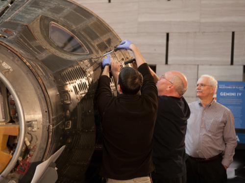 Overseeing Gemini IV Hatch Reinstallation