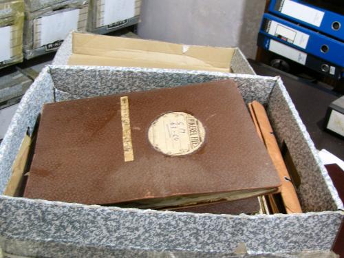 Open box of various items belonging to author Arthur C. Clarke.