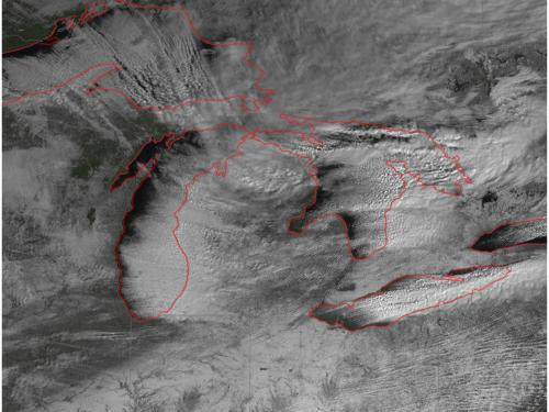 Satellite image of snowfall around the Great Lakes region of the United States and Canada.