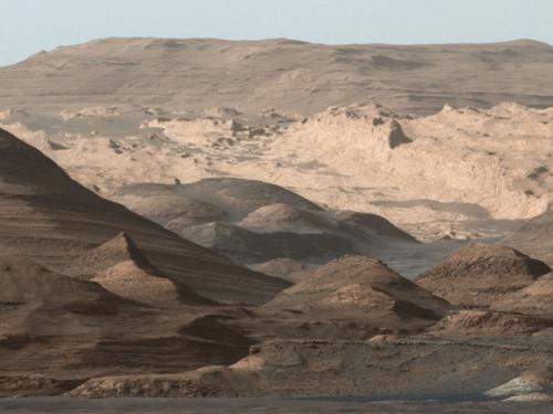 Panoramic view of a higher-altitude mountain landscape on Mars.