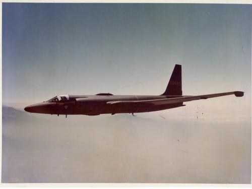 Side view of a jet aircraft with long wings. Aircraft is in flight.