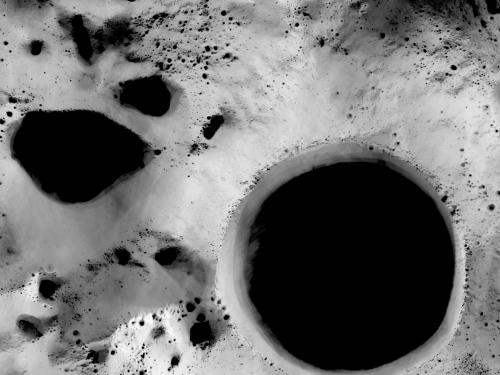 Map view of the south pole region of the Moon, where some areas are determined to be completely unlit by the Sun.