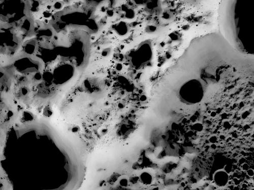 Map of the north pole region of the Moon, revealing which areas of the region receive the least amount of sunlight compared to other areas.