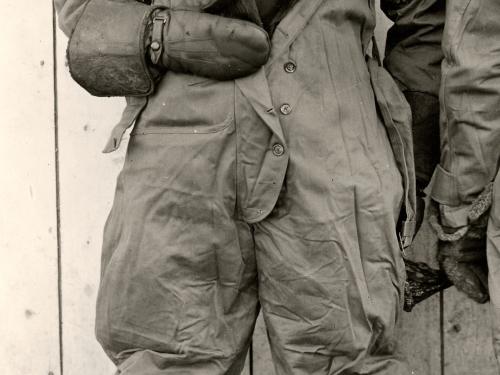 Jack Knight, a white male air mail pilot, stands informally in pilot gear.