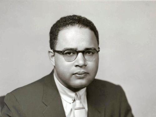 Charles C. Diggs, Jr., an African-American Congressman, poses formally.