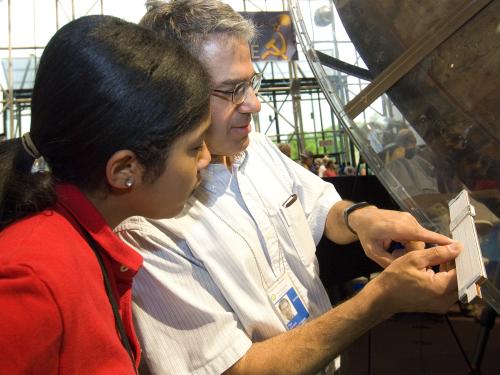 Curator and Visitor during Explore the Universe Day