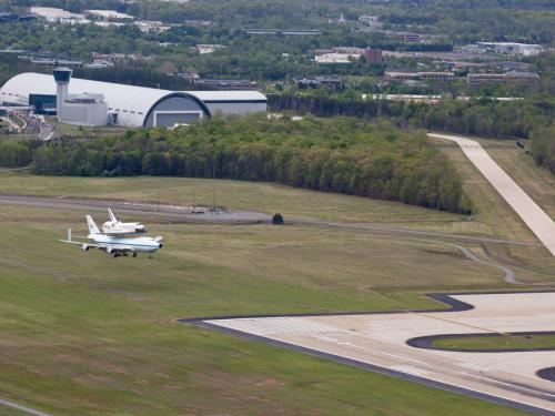 The Space Shuttle Discovery lands on a tarmac near the Udvar-Hazy Center .