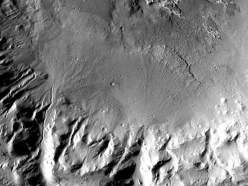 Satellite view of alluvial fans on Mars, which are areas of sediment which are deposited away from geographic features such as rivers.