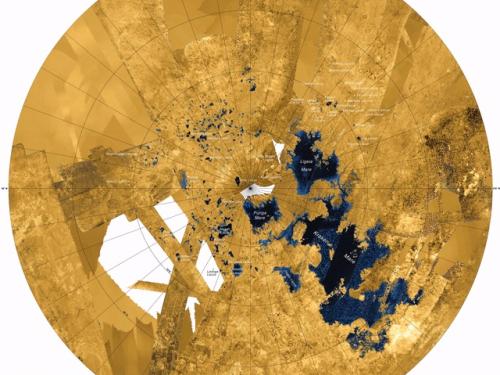 View of the northern section of Titan, a moon of Saturn, with land labeled as yellow and liquid seas and lakes labeled as dark blue.