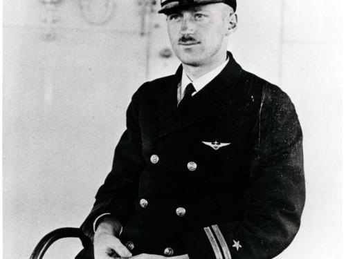 Alfred M. Pride, a white man, sits for a portrait in his U.S. Navy uniform.