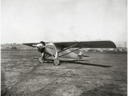 The Spirit of St. Louis, a monoplane with one engine, on flat land.