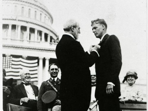 Charles Lindbergh receives a medal at a ceremony following his feat as the first to pilot alone during a nonstop transatlantic flight.