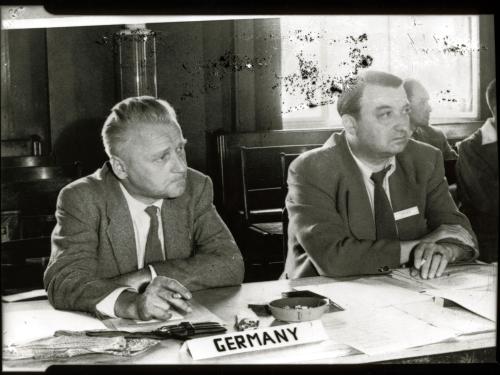 Eugen Sänger, a white male engineer, sits at a table near others.