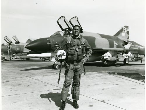 Daniel James Jr., an African-American male, poses formally in front of an aircraft.