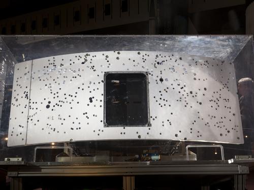 Rear end of planetary camera embedded in glass case.