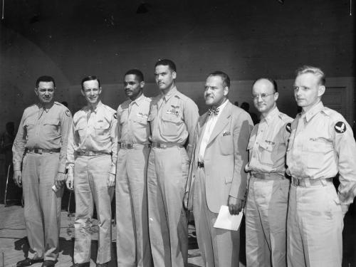 A group of Tuskegee Airmen trainees stand with commander Noel Parrish.