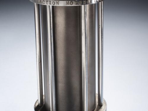 Cylinder-shaped rocket motor with two valves connecting motor to other parts of the rocket.