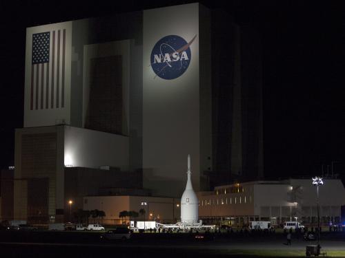 Orion Spacecraft Rolls Past the Vehicle Assembly Building