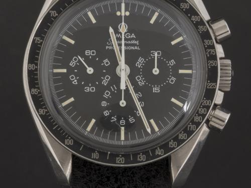 Black and silver analog display and stopwatch with black fabric strap. Dials are seen on the side of the watch.