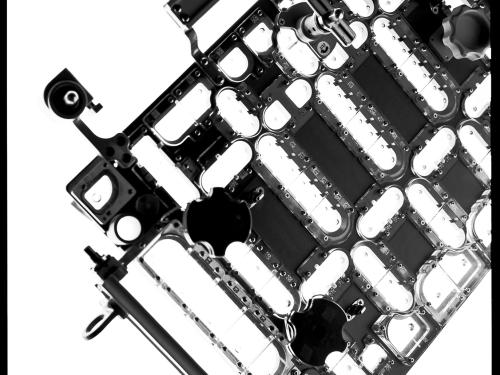 An art piece of a bottom section of a rectangular part of a Hubble Space Telescope spacewalk tool photographed. 