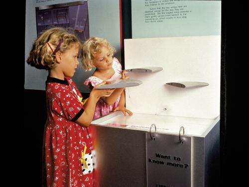 Two curious youngsters learn about wing shapes