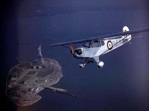 Piper J-3F Cub Flitfire over Statue of Liberty