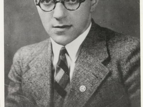 Willy Ley, a white man, poses for a portrait. He is wearing glasses and a suit.