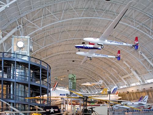 Global Flyer, a white and blue plane with very long wings, hangs on display at the Udvar-Hazy Center.