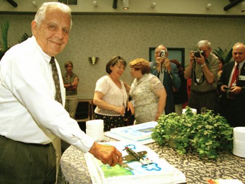 Don Lopez Cuts the Cake on his 80th Birthday