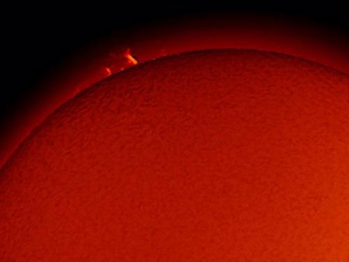 View of a prominence of plasma floating away from the Sun.