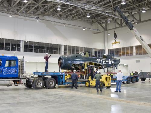 Staff Move <i>Helldiver</i> into Mary Baker Engen Restoration Hangar