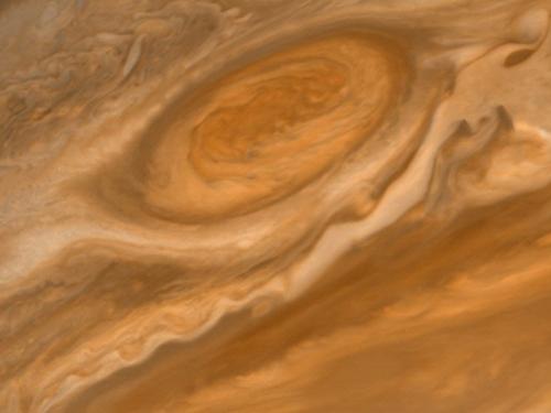 A red swirl of gases found on Jupiter slightly above the equatorial region shown as a darker line of gases.