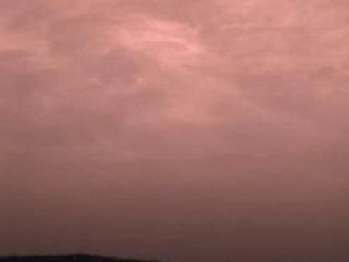 Pink stratus clouds in the atmosphere of Mars.