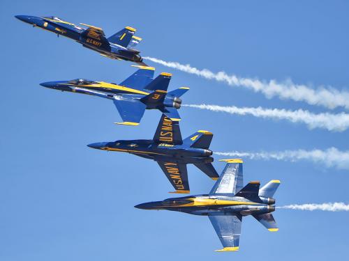 Blue Angels F/A-18C Hornets flying in formation during an airshow