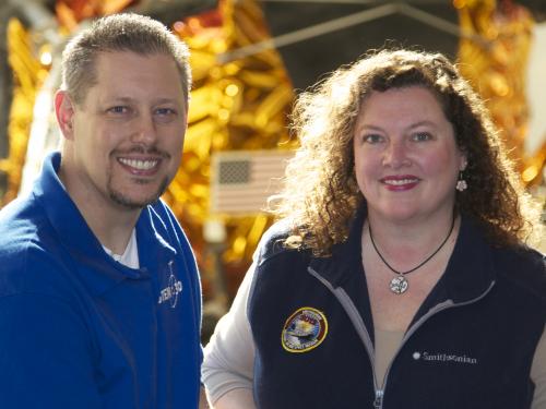 Marty Kelsey, a white man, and Beth Wilson, a white woman, stand together and pose formally.