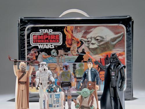 A set of Star Wars toys manufactured for the release of The Empire Strikes Back, 1980. Pictured are R2-D2, Han Solo, Darth Vader, Yoda, Boba Fett, and a Storm Trooper, among others.