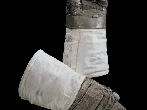 Pair of lunar gloves used on Apollo 11 mission. A special gray fabric makes up most of the gloves with the blue fingertips made from silicon rubber.