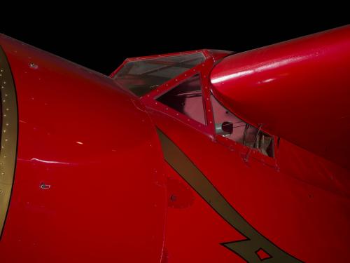 Outside of cockpit of red Amelia Earhart Lockheed Vega 5B aircraft