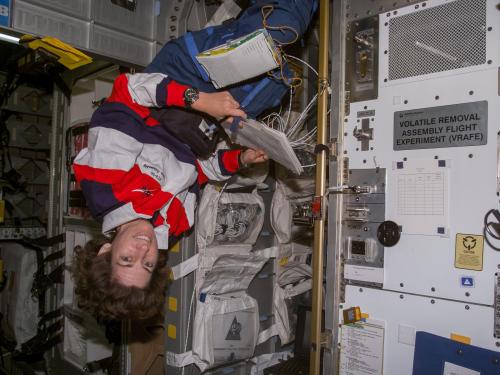 Astronaut Ellen Ochoa, STS-96 mission specialist, in the SpaceHab module aboard the Earth-orbiting Space Shuttle Discovery, 1999.
