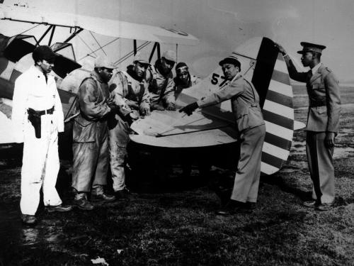 Seven men with an airplane