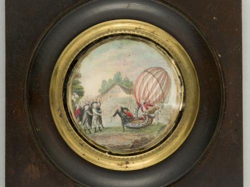 Painting on ivory depicts a balloon on the ground, a man exits the basket, the second man stays in the basket. 