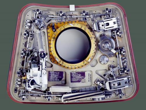Image of a spacecraft hatch against a green background. 
