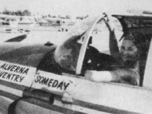 Black and white image of a woman in the cockpit of an airplane. Painted text of the side of the airplane reads: "[first line on left] Good luck Alverna [Second line on left] Sarah Coventry [centered line on right] Someday"