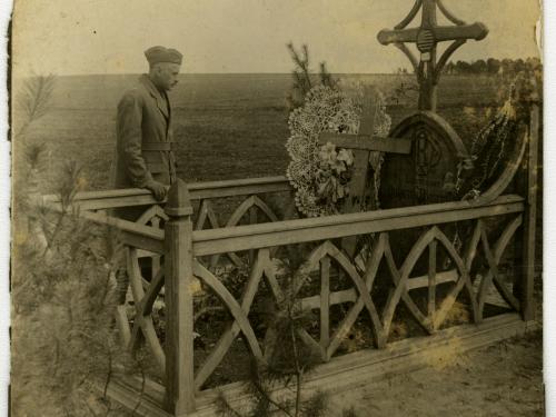 Soldier standing by grave of Quentin Roosevelt