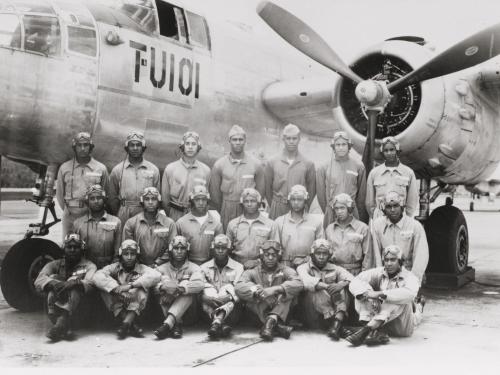 Group of airmen in front of aircraft