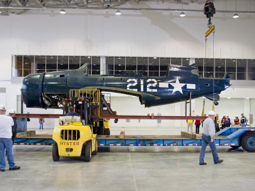 Staff Move <i>Helldiver</i> into Mary Baker Engen Restoration Hangar