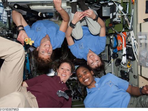 Female Astronauts float in Space