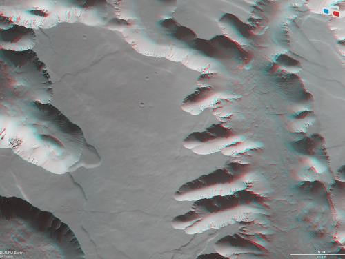 Anaglyph (3-D Image) of Mars’ Noctis Labyrinthus, a maze of deep, steep-walled valleys and channels. 