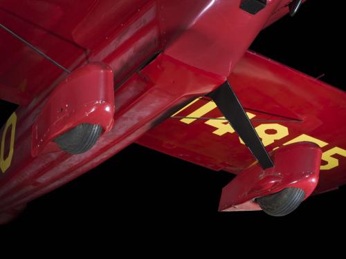 Two wheels and landing gear on red Wittman Special 20 "Buster" aircraft